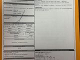 a document with a barcode on it sitting on top of a table