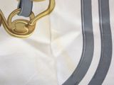 a close up of a pair of shoes on a table cloth