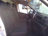 the interior of a car with black seats and a steering wheel