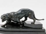 sculpture of a black panther on a black base on a white background