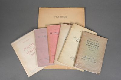 five books are stacked on top of each other on a table