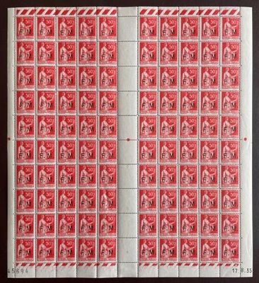 une feuille de timbres rouges et blancs sur un fond noir