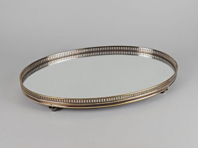 a silver tray with a mirror on top of it