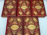 six books of the harry potters series are lined up on a white surface