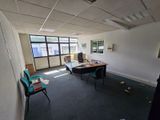 a room with a desk and a chair in it