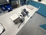 a table that has a bunch of electronics on it