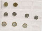 a lot of coins that are in a clear box