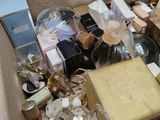 a box full of different types of perfumes and other items