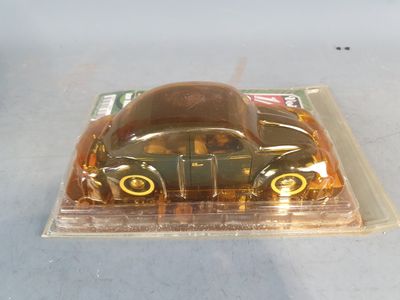 a plastic box with a toy car inside of it