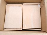 a cardboard box with two pieces of cardboard inside of it