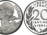 a close up of a coin with a woman ' s face on it