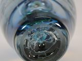 a close up view of a glass bottle with a hole in it