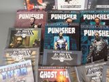 a lot of comic books that are on the table