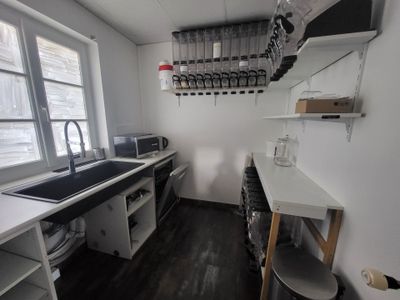 a kitchen with a sink and a window in it
