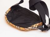 a small black bag with a yellow and black checkered pattern