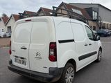 a white van that is parked in a parking lot