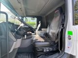a white van with a black seat in the back of it