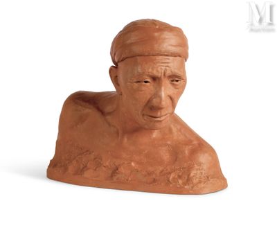 a clay bust of a man with a hat on