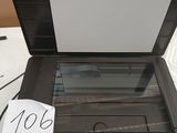 a laptop computer sitting on top of a table with a price tag