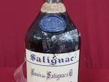 a bottle of liquor sitting on a table with a cork stopper