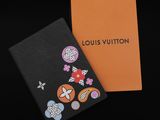 a louis vuitton notebook with flowers and butterflies on it