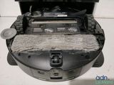 a black and white photo of a vacuum cleaner in a box