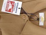 a brown coat with a tag on it