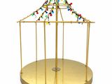 un carrousel doré illuminé sur fond blanc