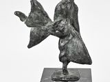 statue of a woman holding a bird on a black marble base