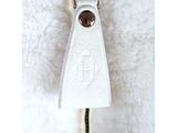 zipper of a white purse with a metal zipper on a white background