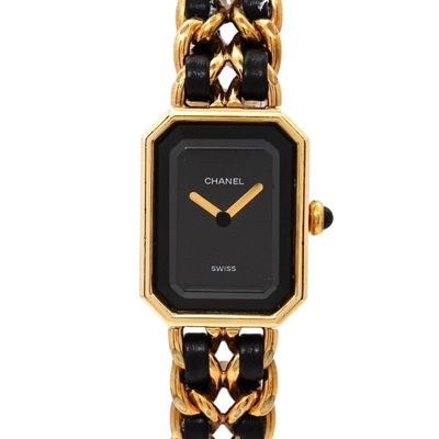 an image of a black and gold watch with a chain link bracelet