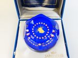 a blue glass plate with stars on it in a box