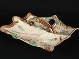 an image of a decorative dish with a fish on it
