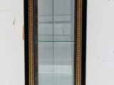 a small display case with a glass door in the middle