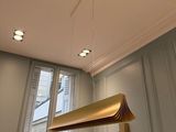 a lamp that is hanging from the ceiling in a room