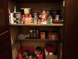 a pantry with a lot of food on the shelves