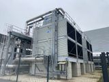 a large building that has a lot of pipes on it