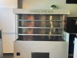 an image of a kitchen with a counter and a refrigerator