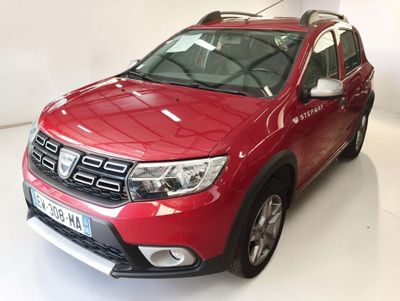 the red dacia is parked in the white room of a dealers showroom
