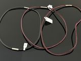 a close up of three wires connected to a computer cable