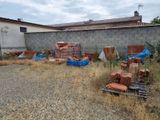 a lot of junk on the ground in front of a building