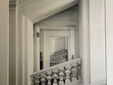 a black and white photo of a staircase in a building