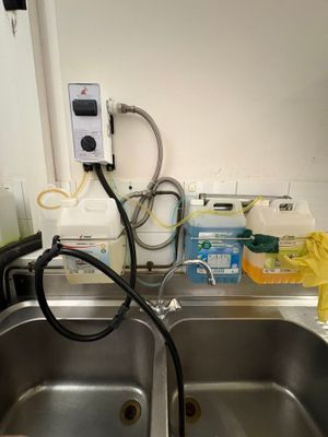 a sink that has a faucet in it and a hose attached to it