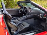 the interior of a red sports car with its doors open