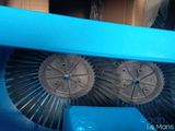 two blue brushes that are on top of a blue box