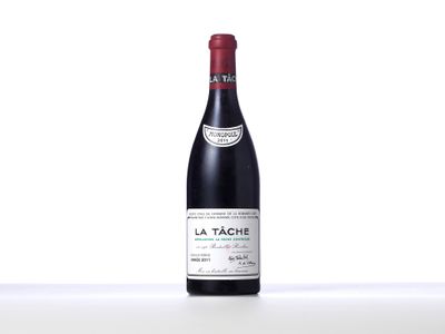a bottle of red wine sitting on top of a table