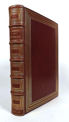 an old book sitting on top of a table next to a white background