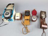 a lot of different types of cell phones on the table
