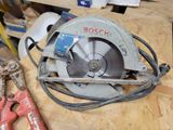 a picture of a circular saw sitting on a workbench