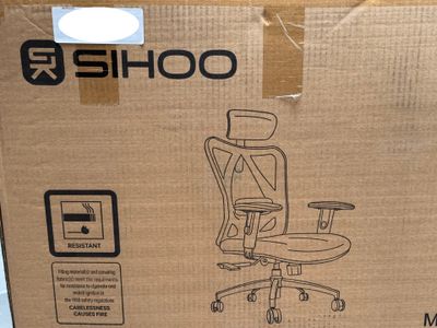 a cardboard box with a picture of a computer chair in it